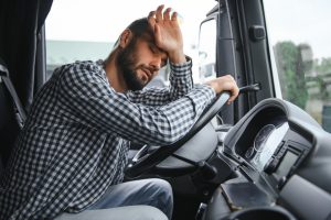 man trucker tired driving in a cabin of his truck 2025 03 17 00 38 18 utc